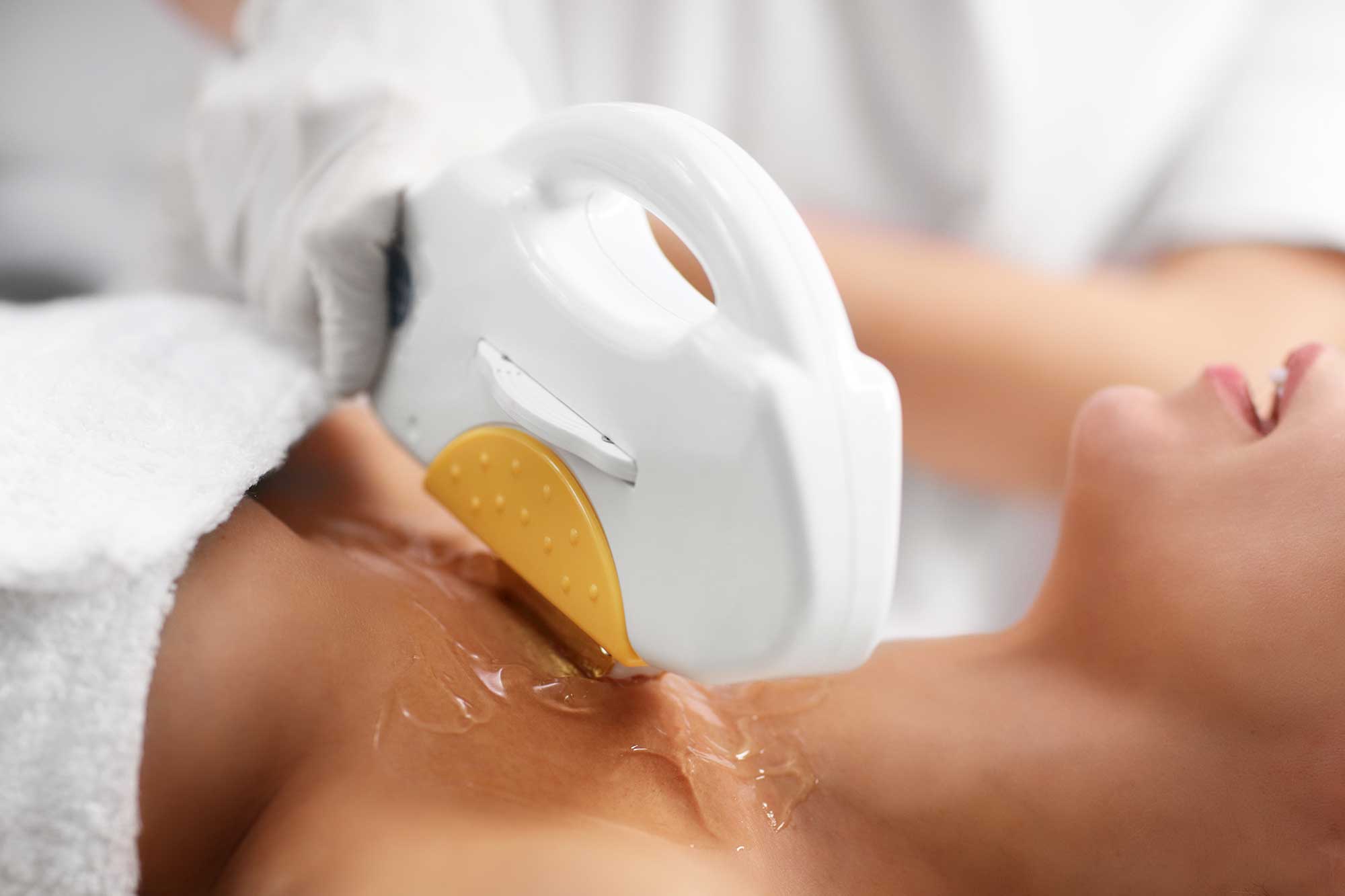 beautician-giving-epilation-laser-treatment-to-woman